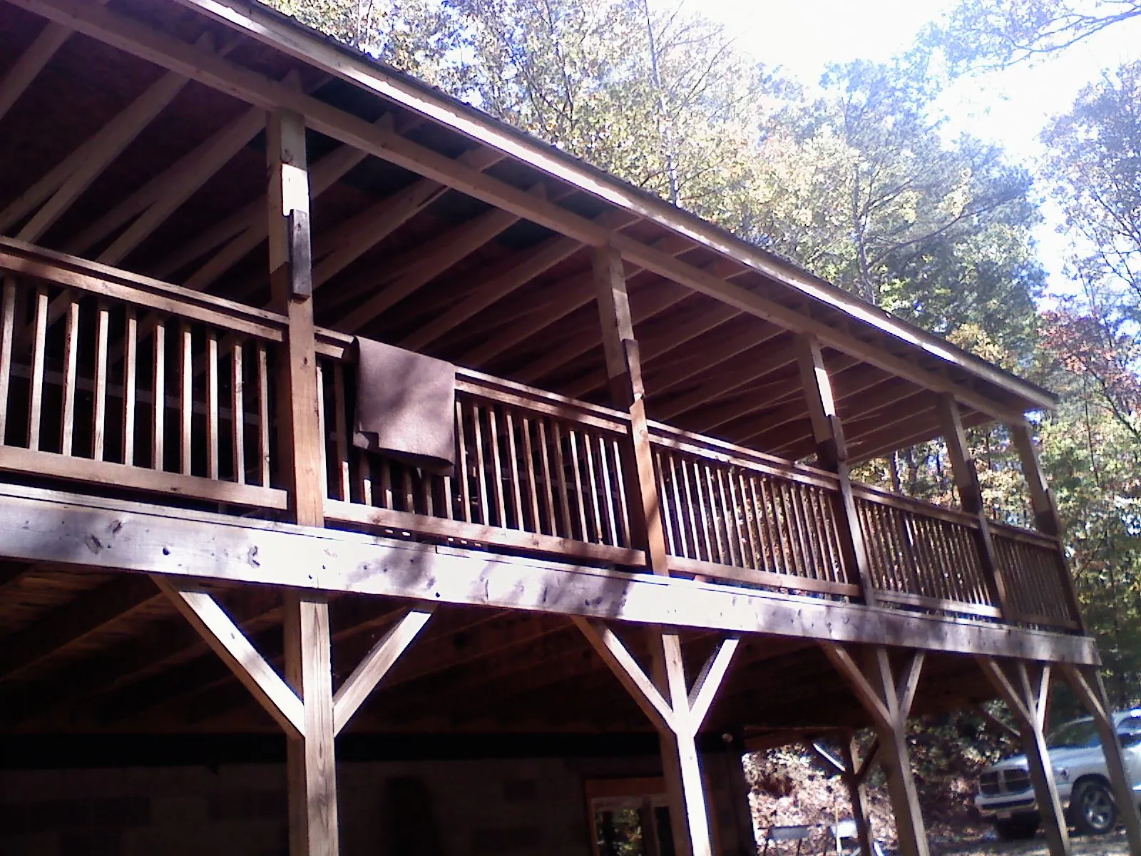 Timber framing under a new elevated porch and deck — Roof Leak Repair in Varna by Roofing Brothers